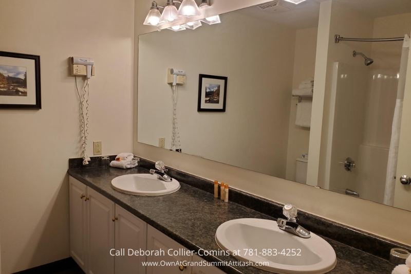 Spacious bathroom inside Unit 337 Interval 4 at Grand Summit Hotel, featuring dual sinks, a large vanity mirror, and modern lighting for a comfortable stay