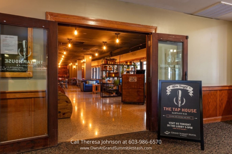 Entrance to The Tap House at the Grand Summit Hotel, Bartlett, NH, with a warm and inviting ambiance. Guests staying at Unit 149 Interval 4 can enjoy fine dining steps away.