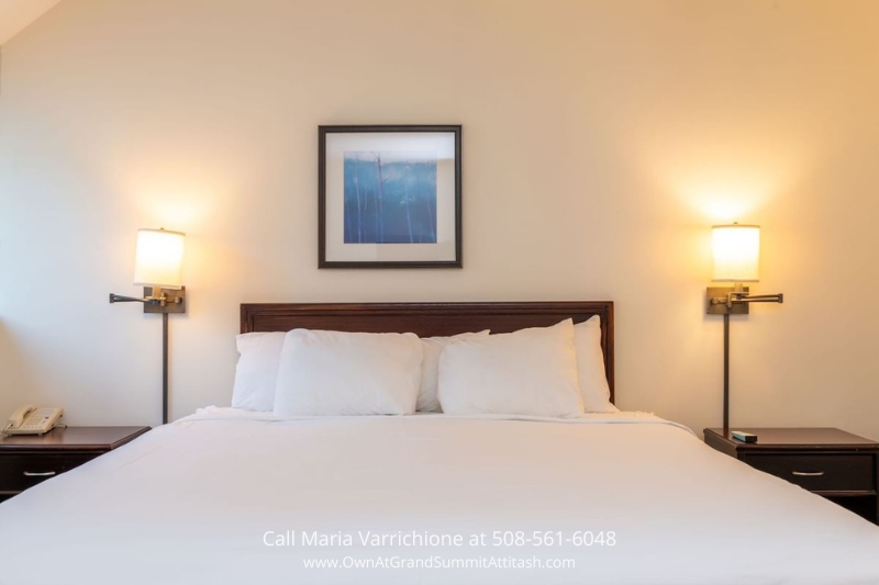 Spacious bedroom in Unit 337 Interval 3 at the Grand Summit Hotel, featuring a comfortable bed, stylish decor, and soft lighting for a restful night’s sleep.